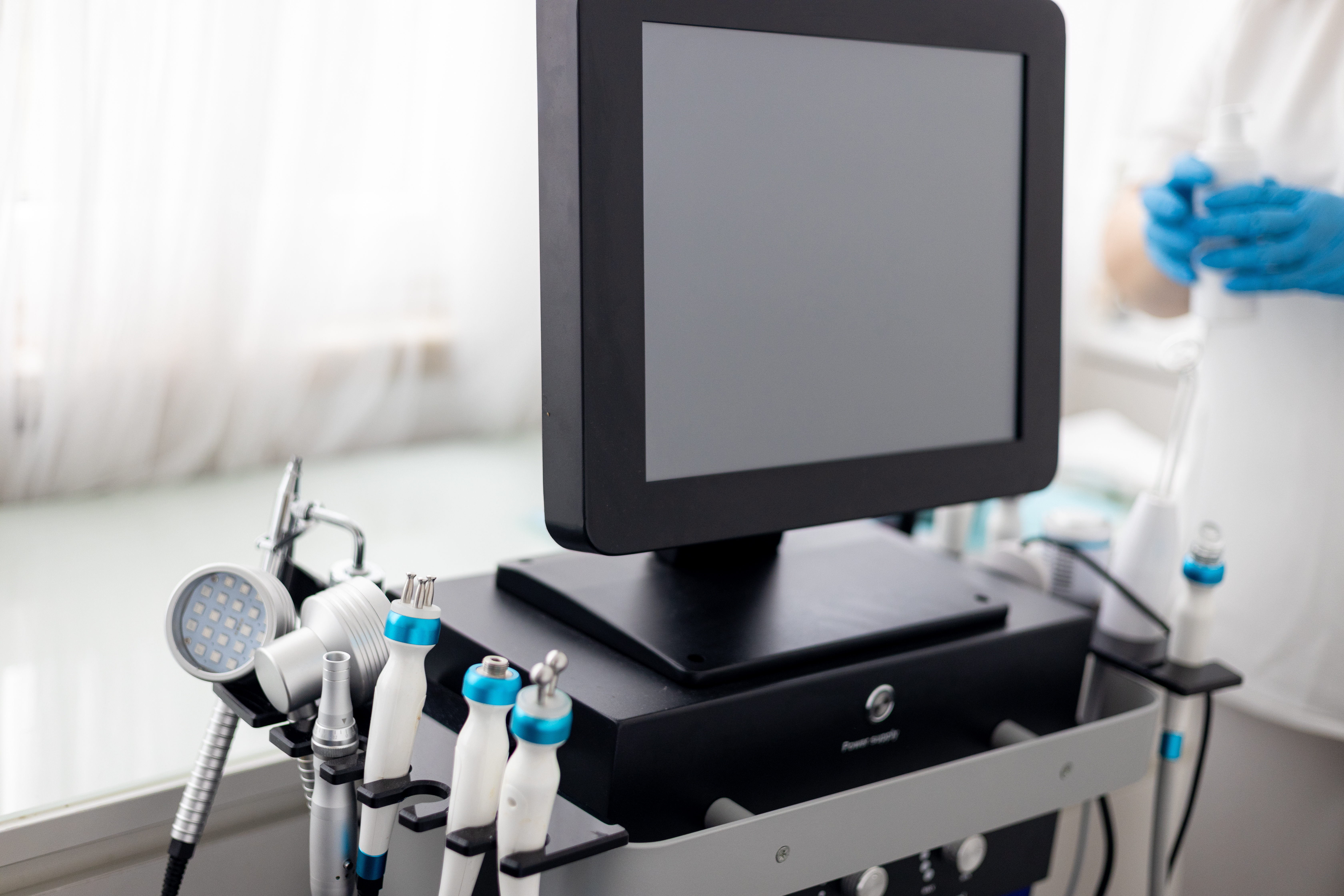 Medical diagnostic equipment with multiple handheld instruments and monitor display in clinical setting